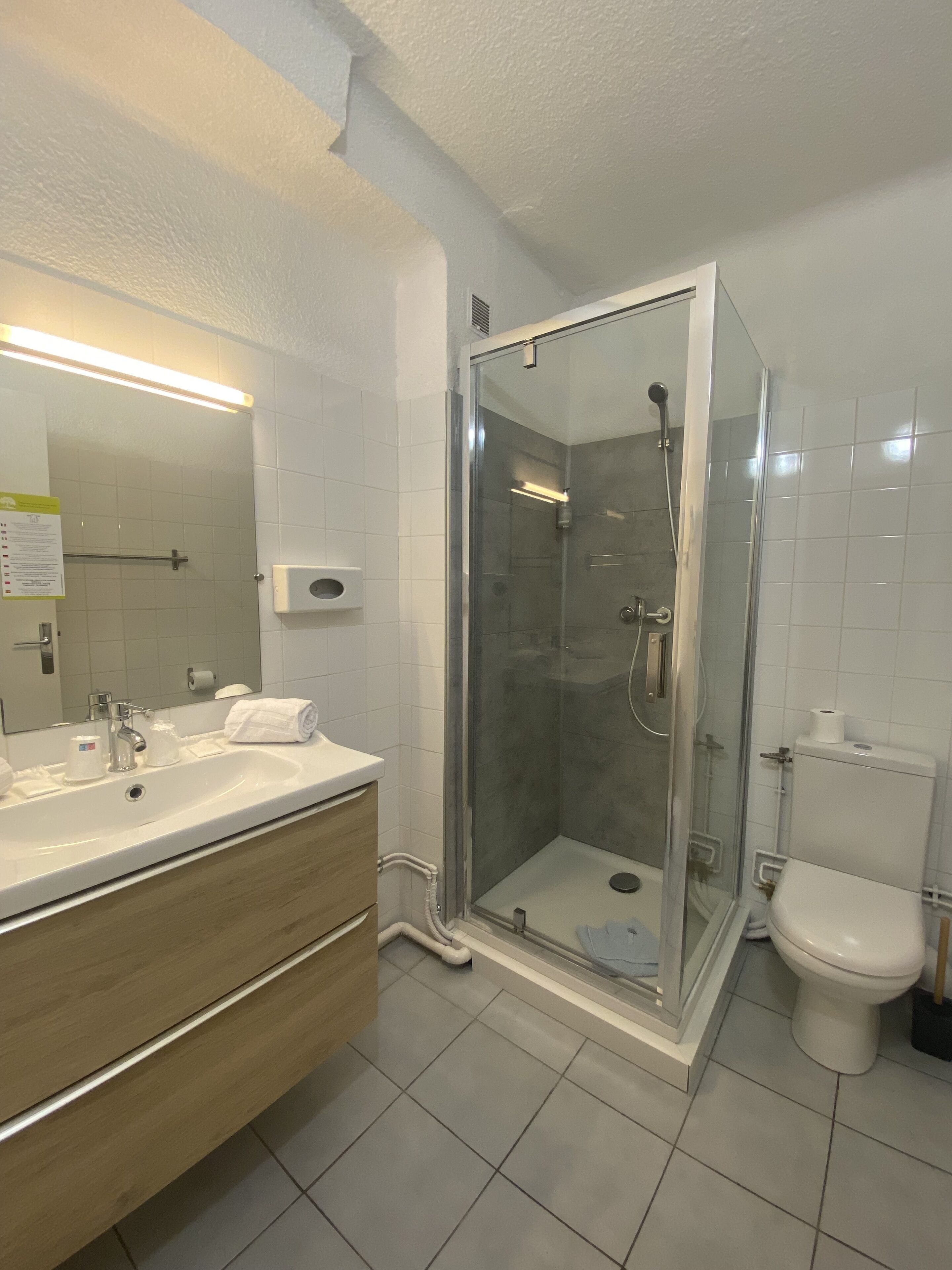 economy triple room, courtyard view | bathroom | free toiletries, hair dryer, towels