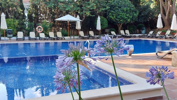 Outdoor pool, pool umbrellas, pool loungers