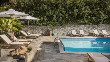 Seasonal outdoor pool, pool umbrellas, pool loungers