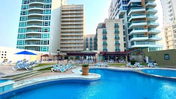 Outdoor pool, pool umbrellas, sun loungers