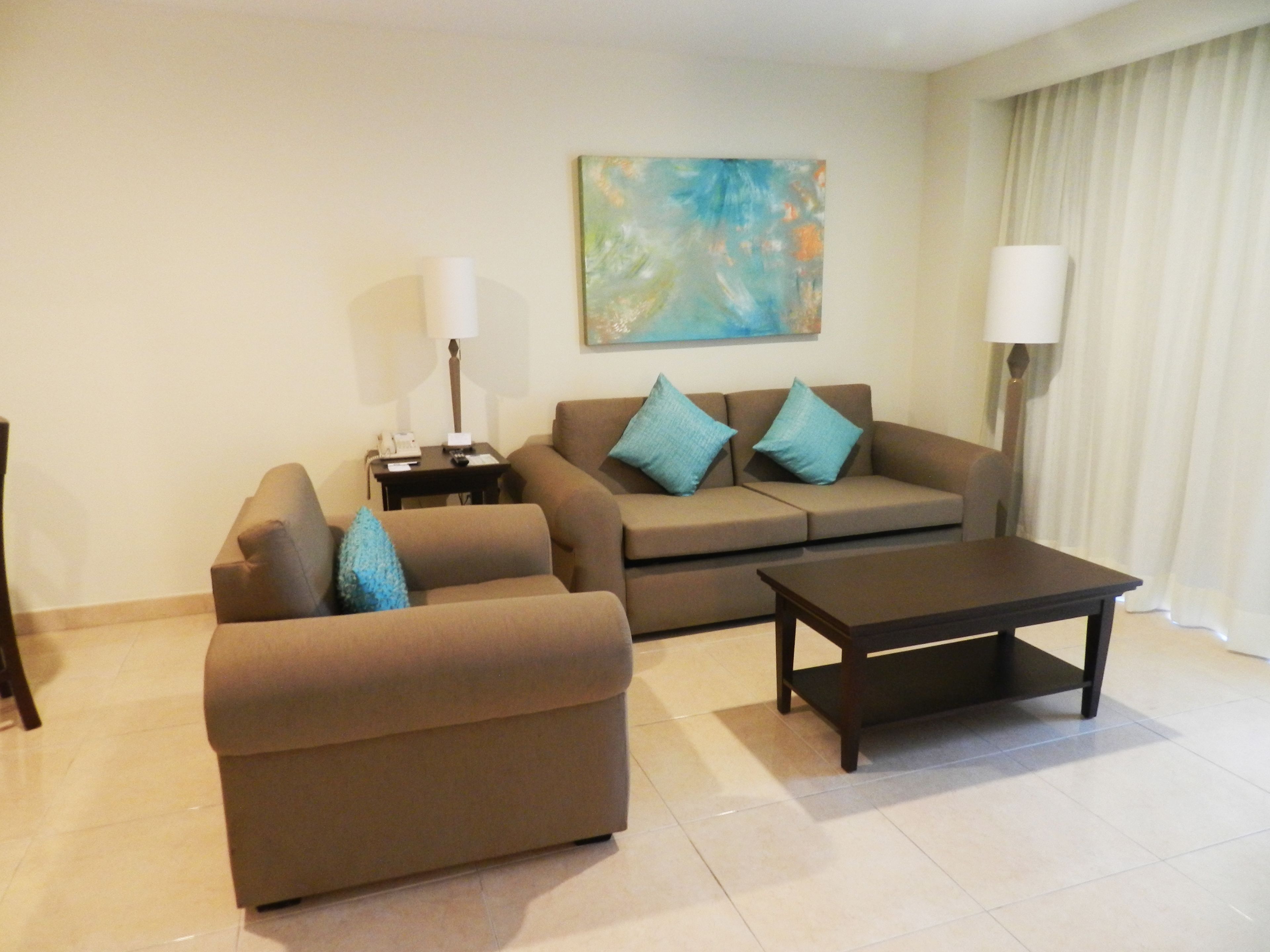 suite, 2 queen beds, sea view | living room | flat-screen tv