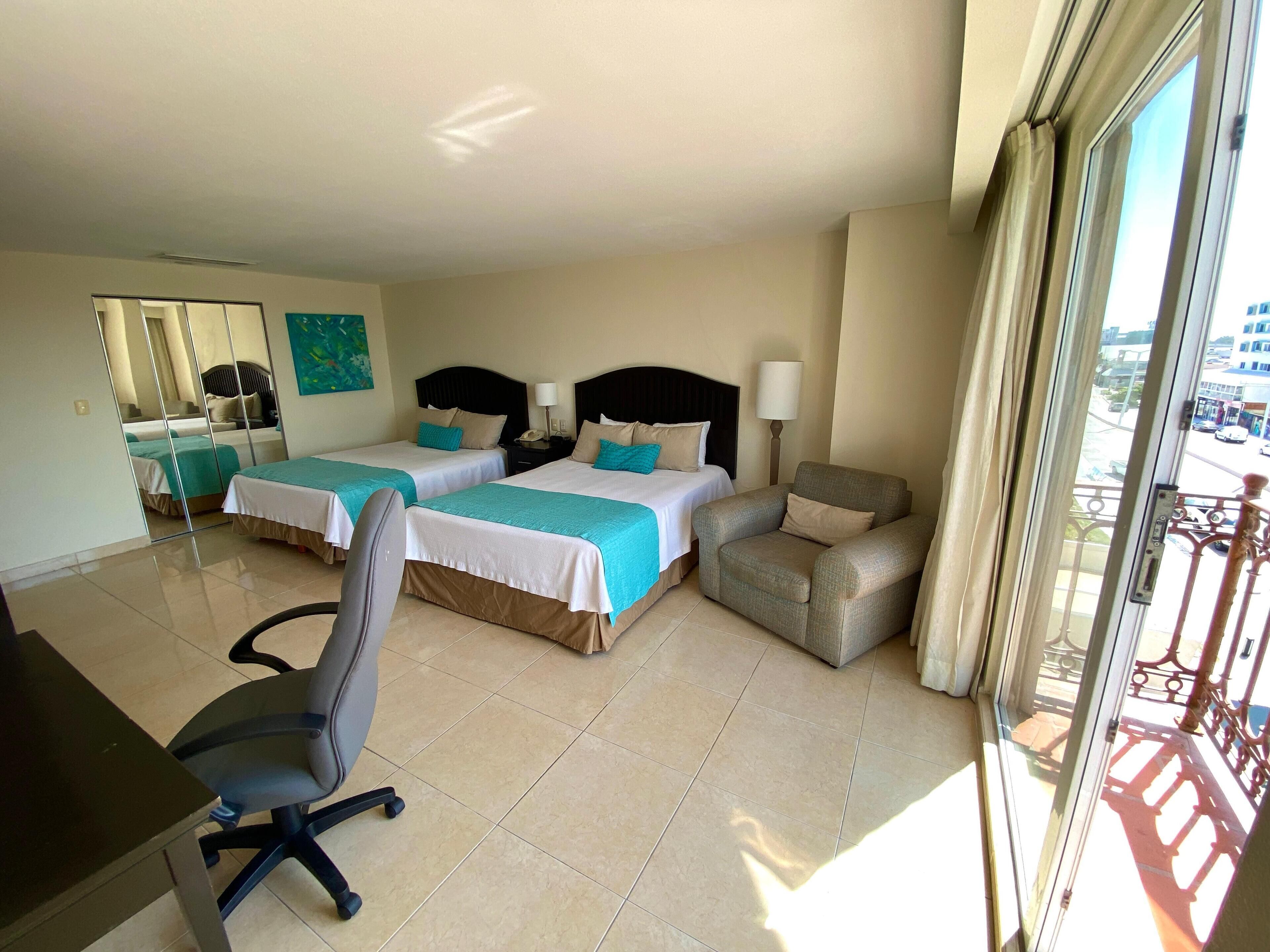 Standard Room, 2 Queen Beds, City View | In-room safe, desk, soundproofing, iron/ironing board