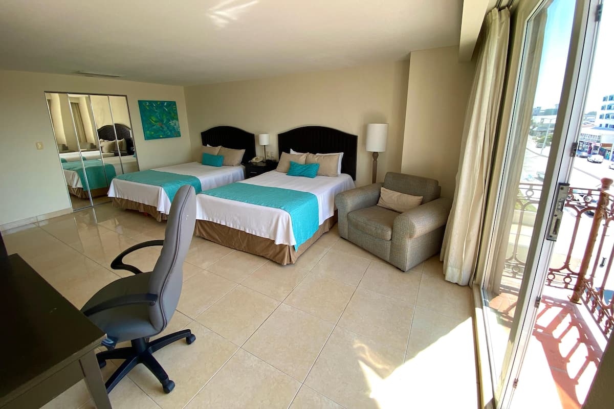 Standard Room, 2 Queen Beds, City View | In-room safe, desk, soundproofing, iron/ironing board