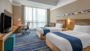 A hotel room with two beds, a desk with a TV, a chair, a small table, and a colorful striped carpet. - Holiday Inn Express Tianjin Heping by IHG (Tianjin)