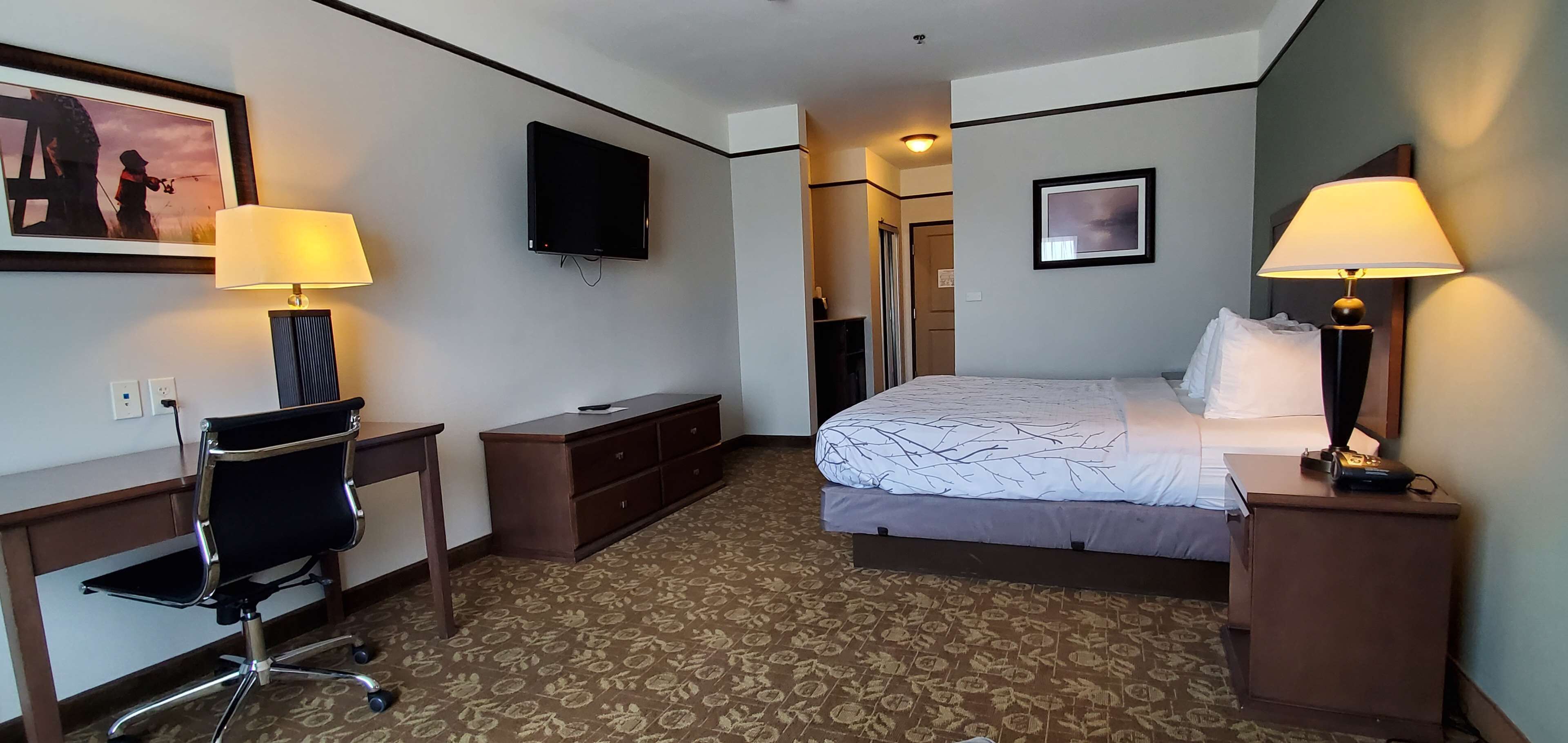 pillow-top beds, desk, laptop workspace, blackout curtains