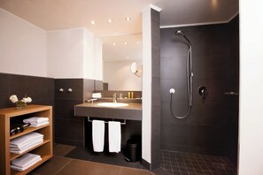 Designer toiletries, hair dryer, bathrobes, slippers