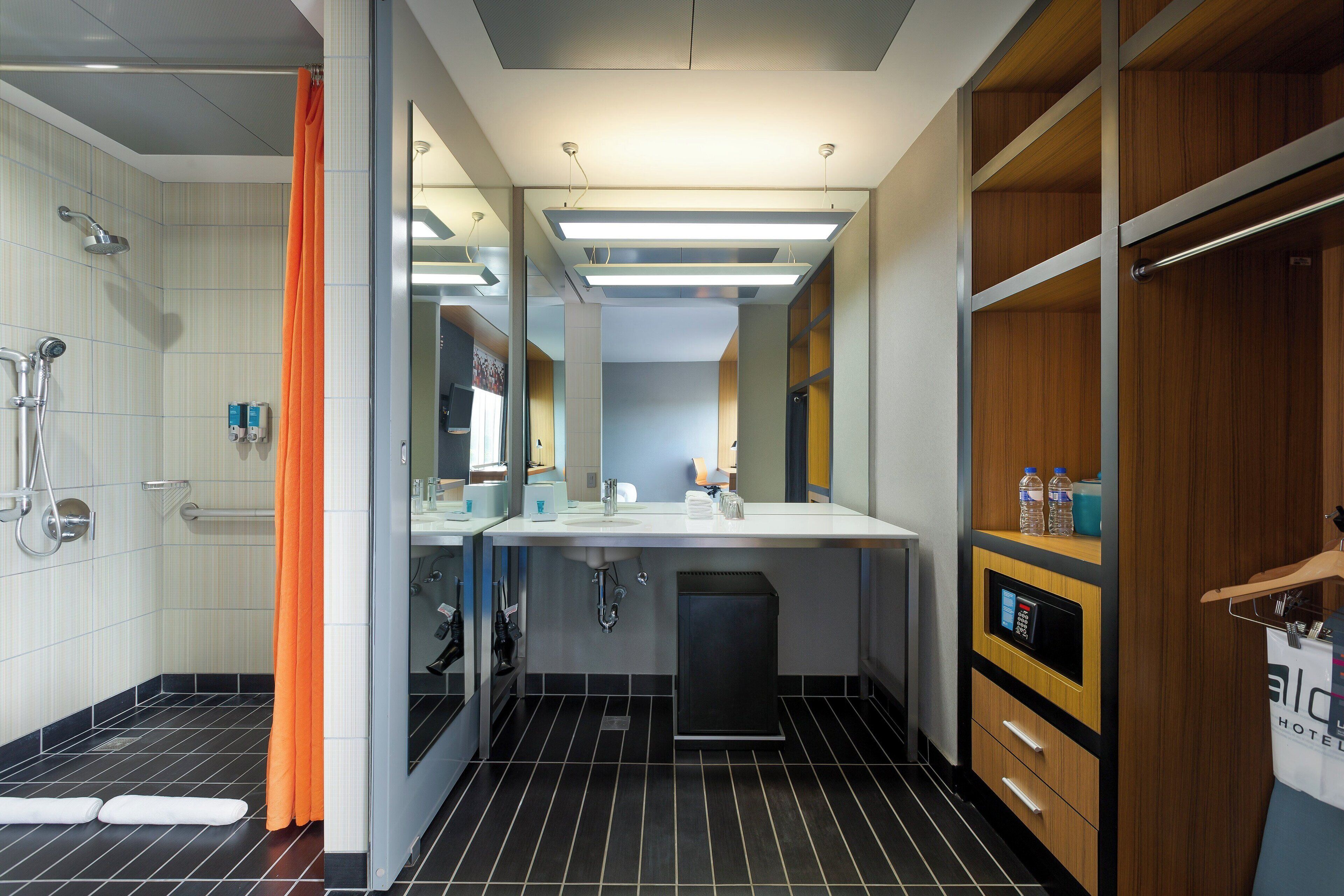 shower, designer toiletries, hair dryer, towels