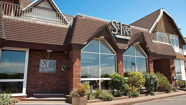 A building with a 'S' logo, large windows, and a brick facade. - St Ives Hotel (Lytham St. Anne's)