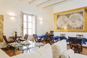 Enjoy dining in a comfortable setting with a large map on the wall and wooden furniture.