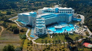A large hotel with multiple buildings, a central pool area, and surrounding greenery. - Atrium Platinum Luxury Resort Hotel & Spa (Rhodes)