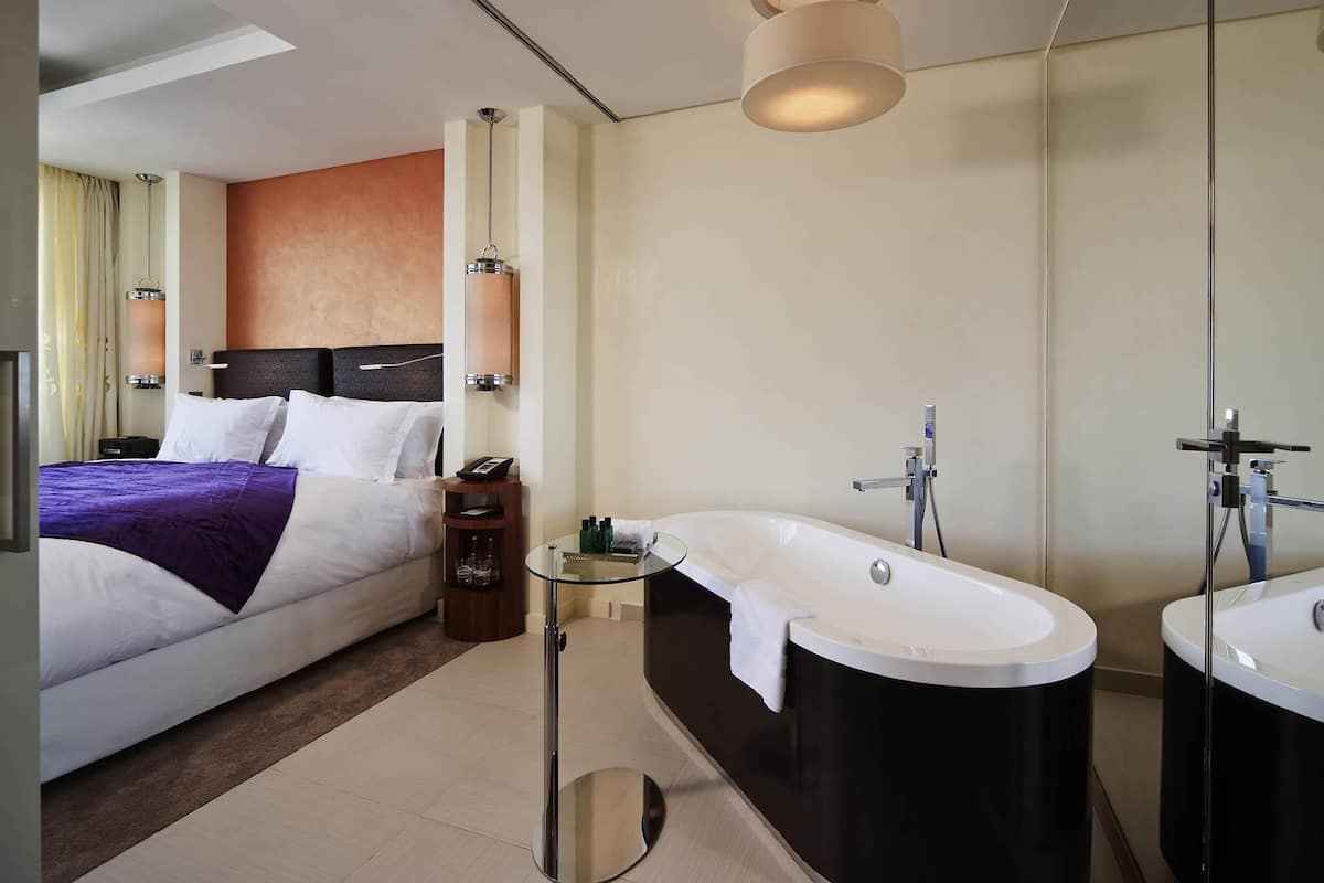 Junior Suite, Multiple Beds | Premium bedding, minibar, in-room safe, desk