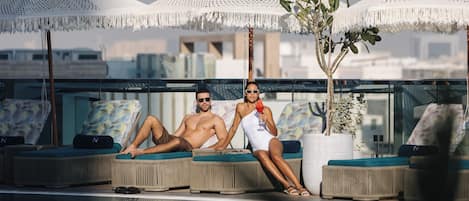 Outdoor pool, pool umbrellas, sun loungers