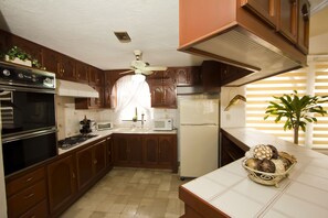 Full-sized fridge, microwave, stovetop, coffee/tea maker