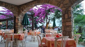 Breakfast, lunch, dinner served; Italian cuisine, garden views 