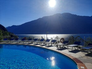 Seasonal outdoor pool, open 9:30 AM to 8:30 PM, pool umbrellas