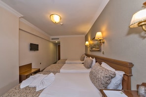 Triple Room | Memory foam beds, minibar, in-room safe, desk