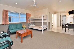 Apartment, 2 Bedrooms | Living area | 18-inch TV with cable channels - Auckland Northshore Motels & Holiday Park (Auckland)