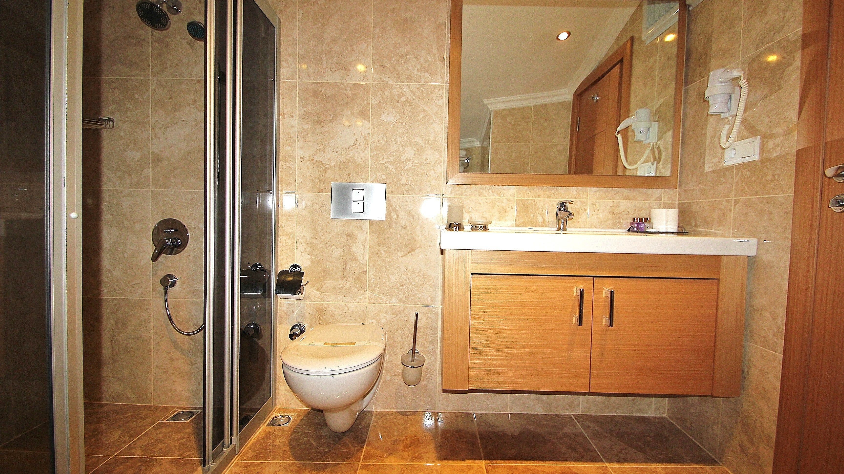 superior double room | bathroom | shower, hair dryer, slippers, towels