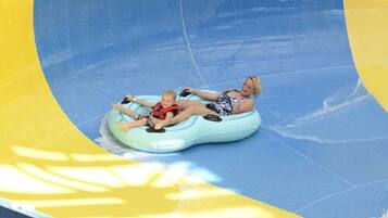 A water slide with a curved blue and yellow design.