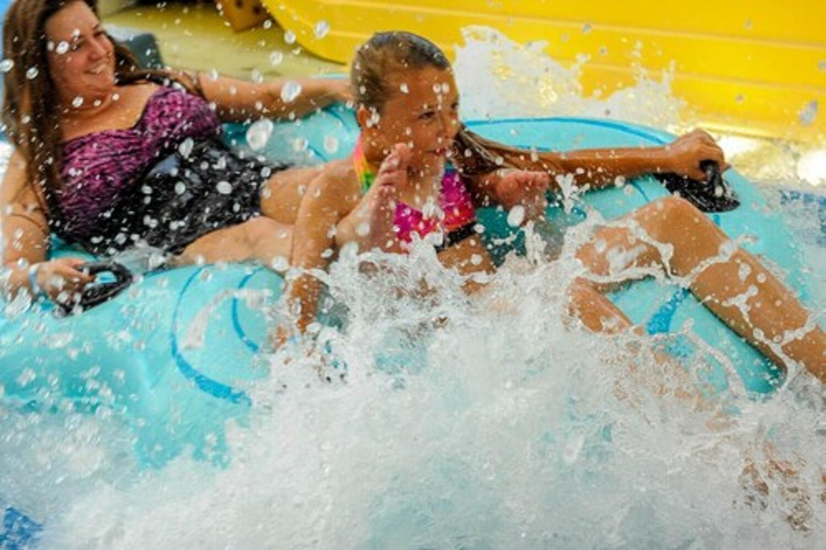 Two people in a water slide.