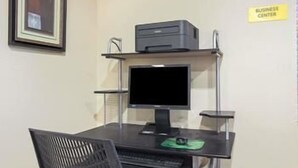A business center with a computer desk, monitor, keyboard, and printer. - Crystal Inn Houston North I-45 (Houston)