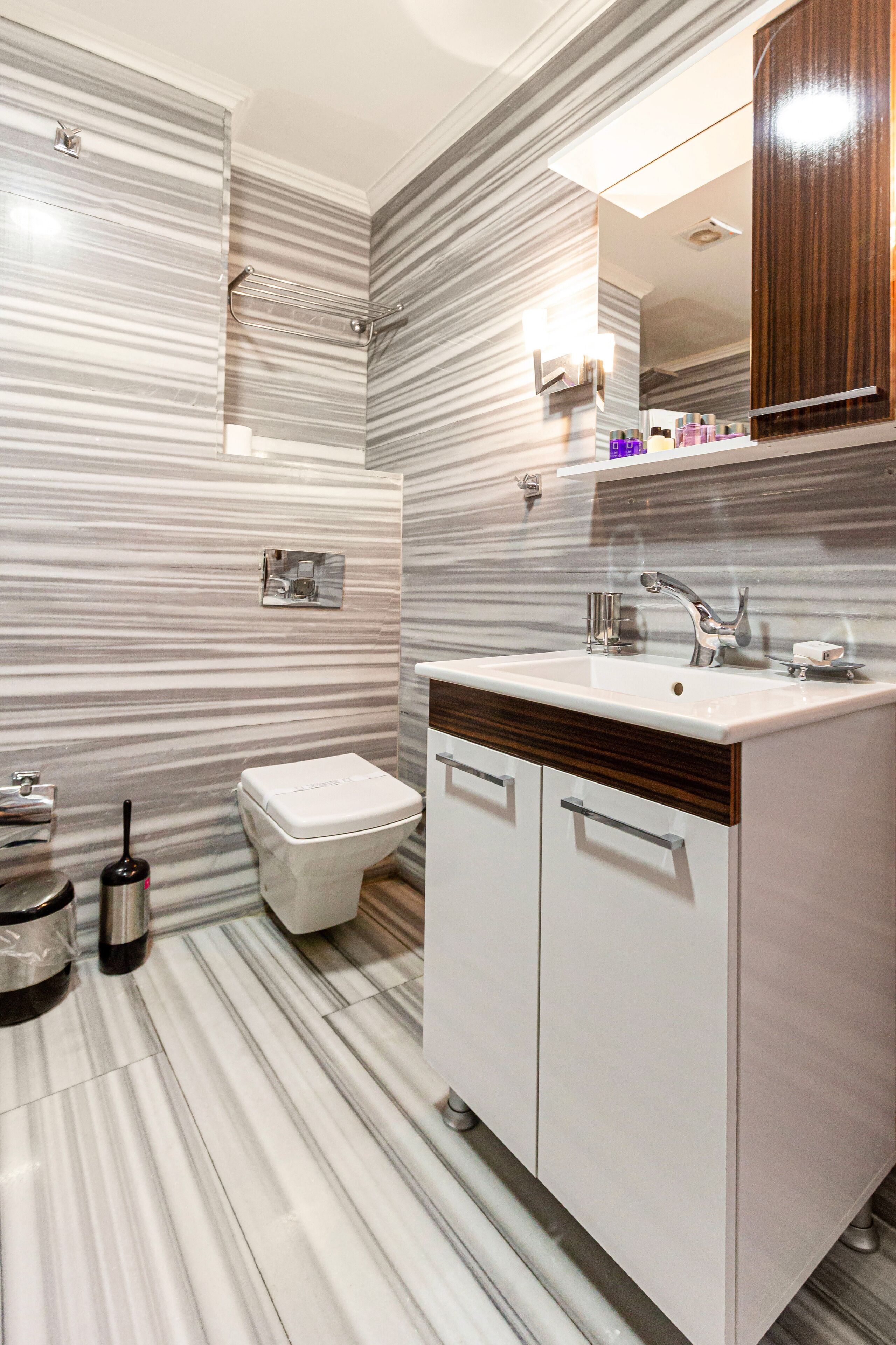 deluxe quadruple room | bathroom | shower, free toiletries, hair dryer, bathrobes