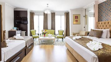 Deluxe Quadruple Room | Premium bedding, minibar, in-room safe, iron/ironing board