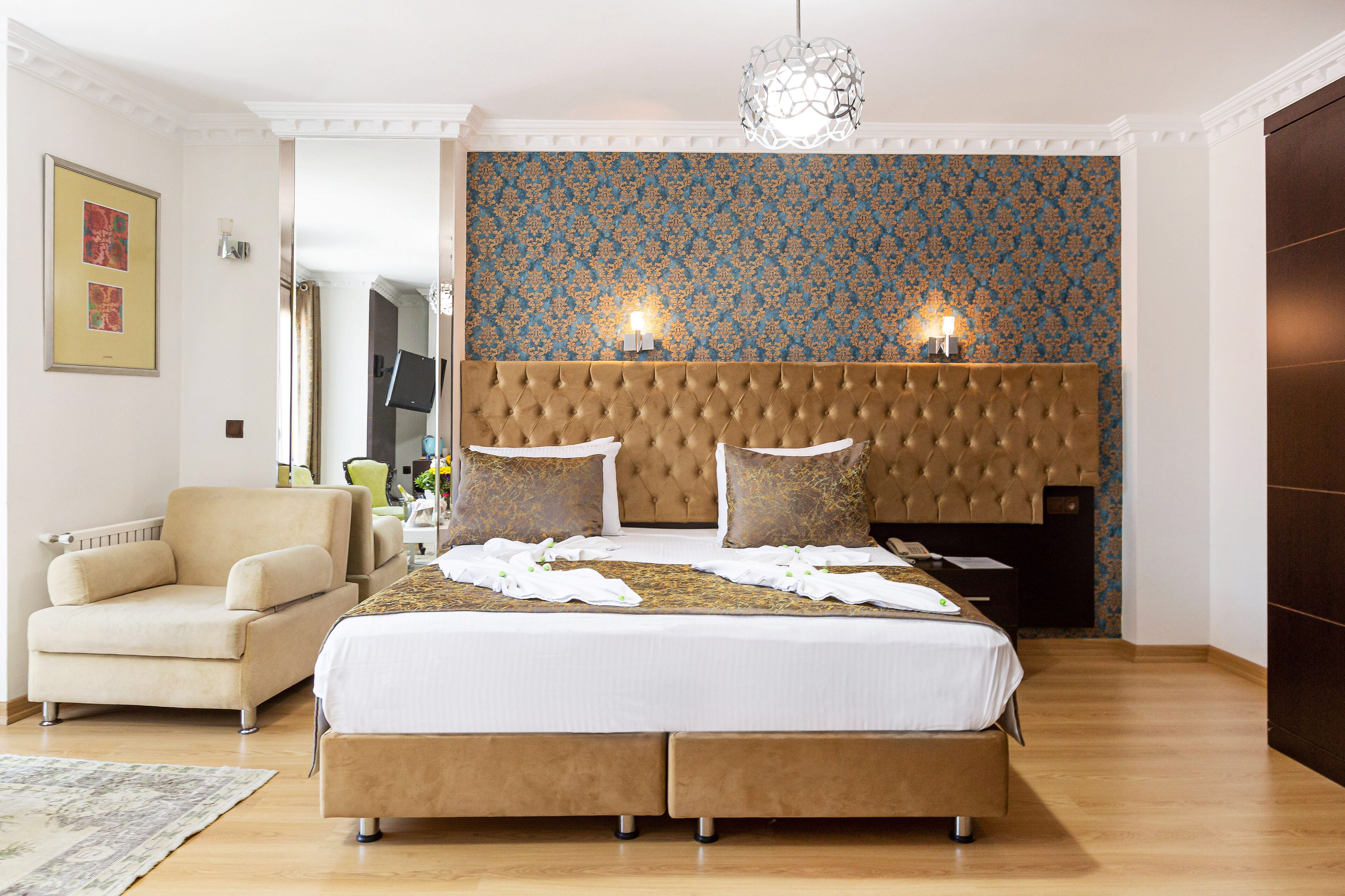 deluxe quadruple room | premium bedding, minibar, in-room safe, iron/ironing board