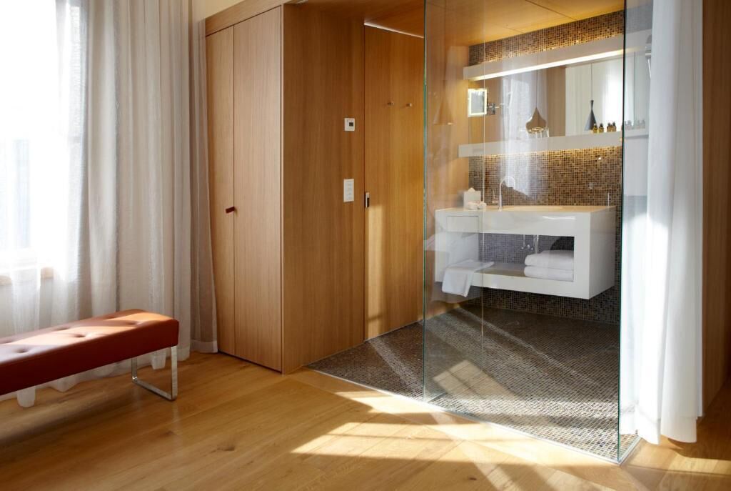 Separate tub and shower, hair dryer, slippers, towels