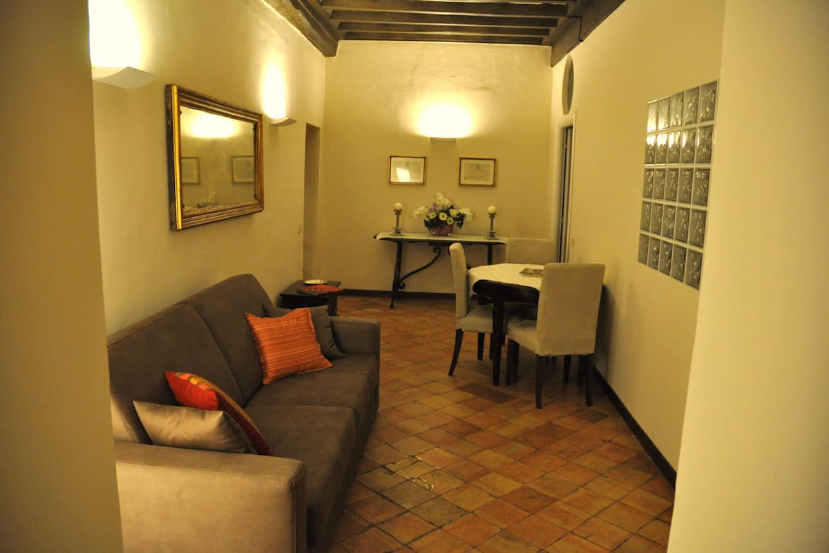 Apartment, 2 Bedrooms, Annex Building (Via dei Leutari) | Living area | 22-inch TV with digital channels