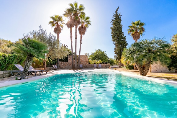 Seasonal outdoor pool, pool umbrellas, pool loungers