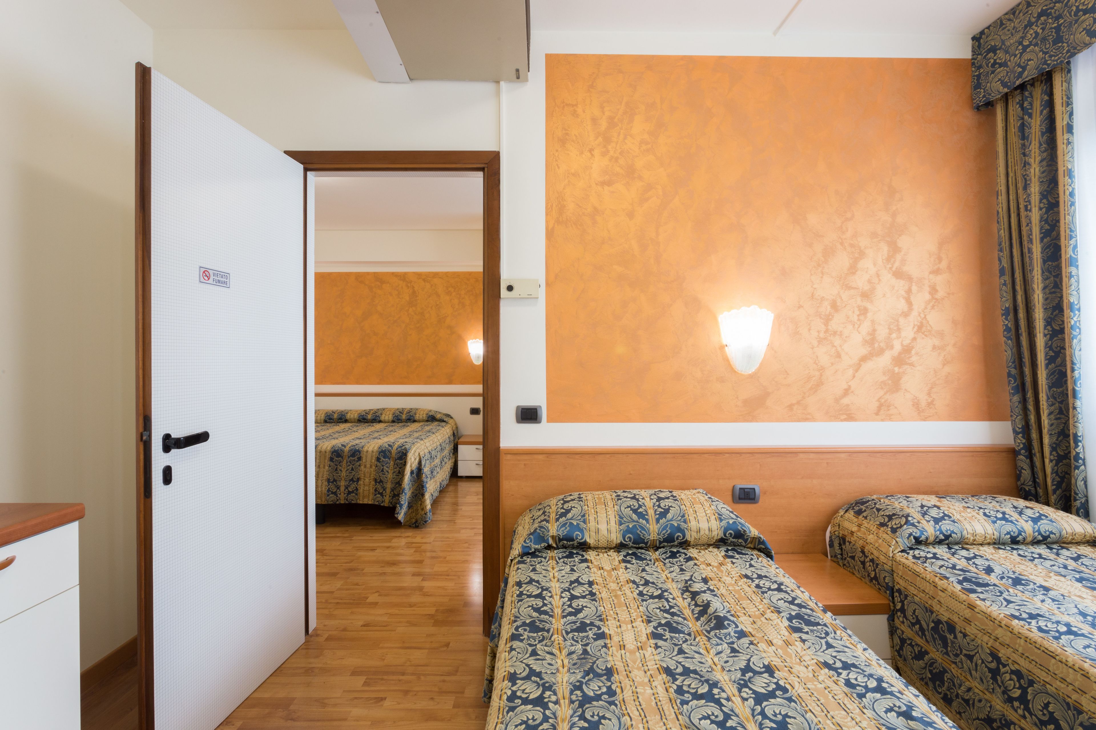 family room, 2 bedrooms | in-room safe, desk, laptop workspace, blackout curtains