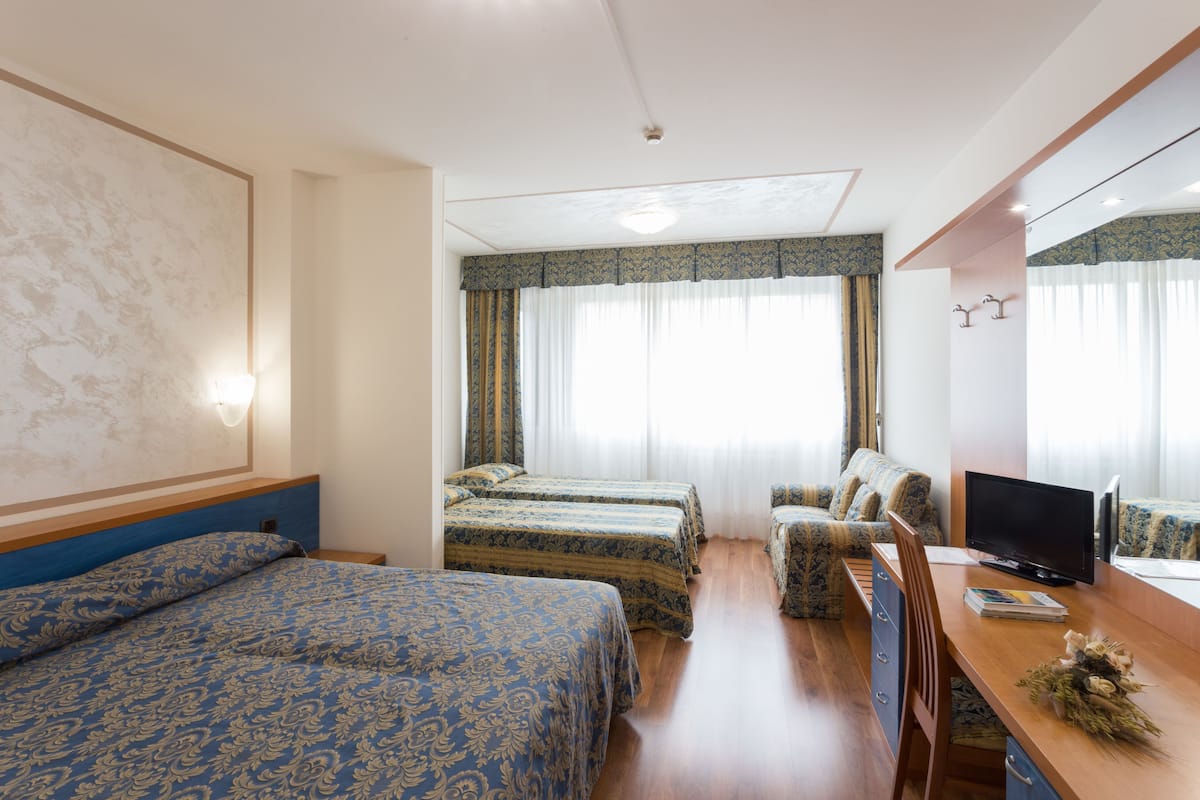 Quadruple Room | In-room safe, desk, laptop workspace, blackout curtains