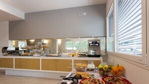 A breakfast buffet with various food items and a coffee station. - Hotel Airmotel (Mestre)