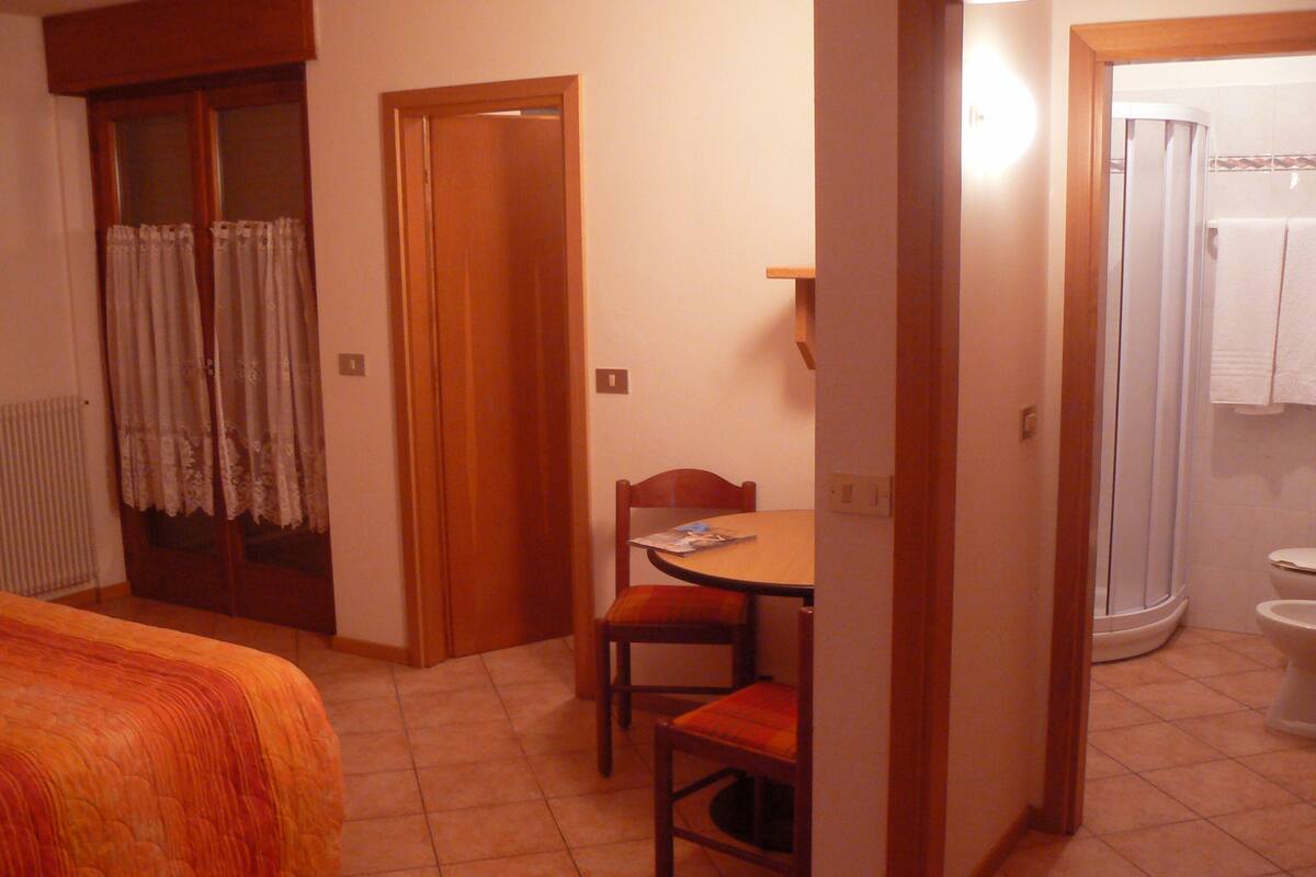 Standard Apartment, Kitchenette | Living area | Flat-screen TV