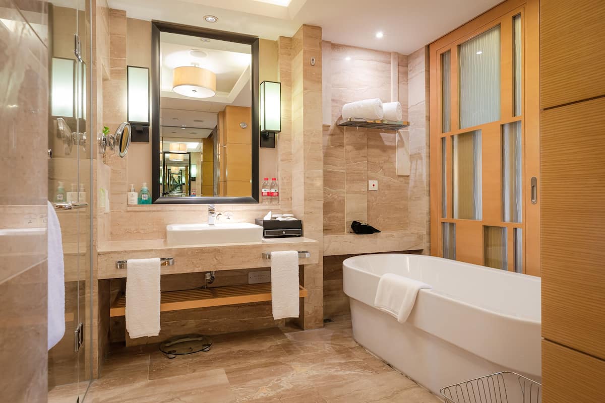 deluxe room with lake view | bathroom | separate bathtub and shower, deep-soaking bathtub, rainfall showerhead