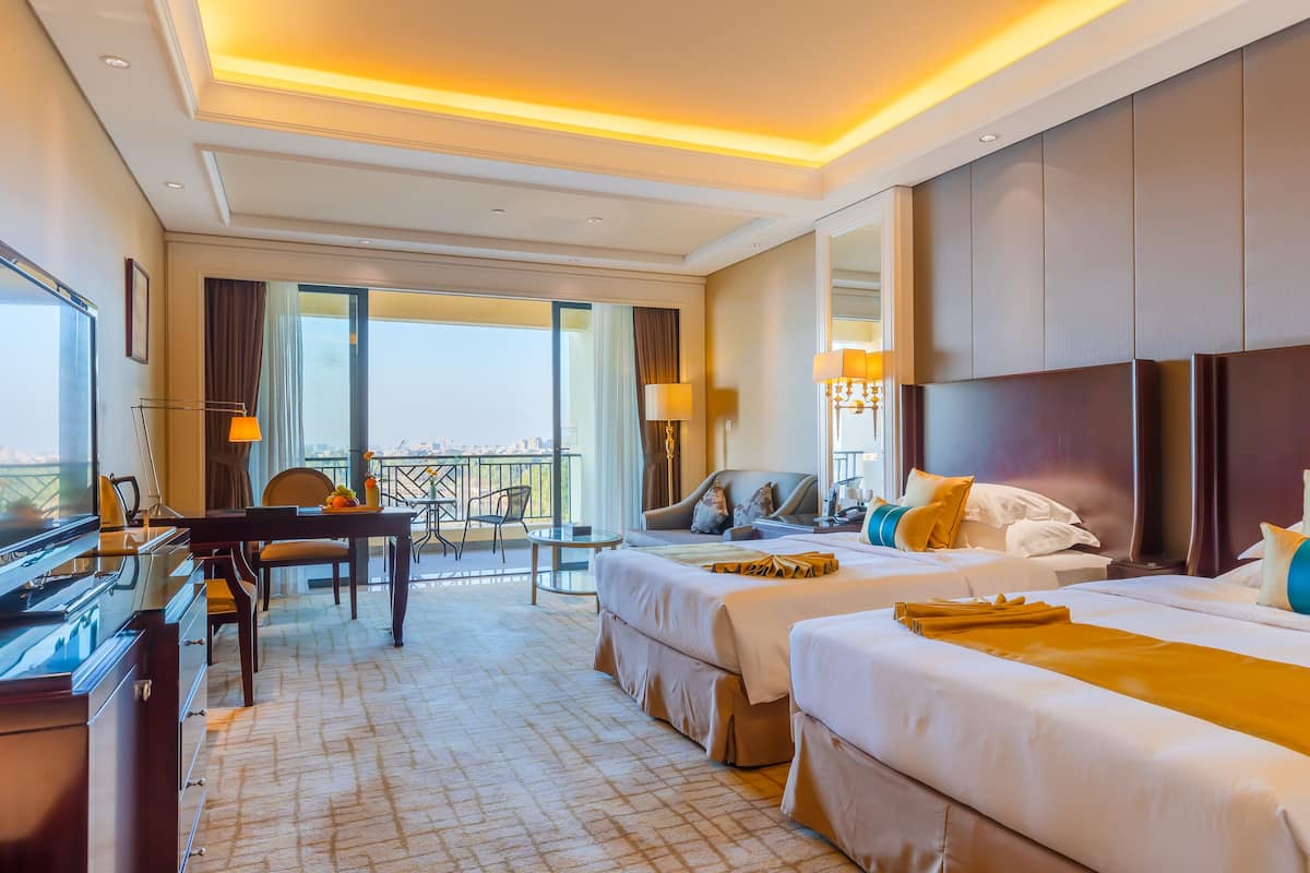 deluxe room with garden view | premium bedding, minibar, in-room safe, individually decorated