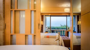 A hotel room with a large bathtub, two beds, a balcony with a view, and a sliding glass door. - Yourworld International Conference Center (Jinhua)