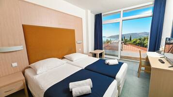 Twin Room, Bathtub, Sea View | In-room safe, desk, laptop workspace, free WiFi