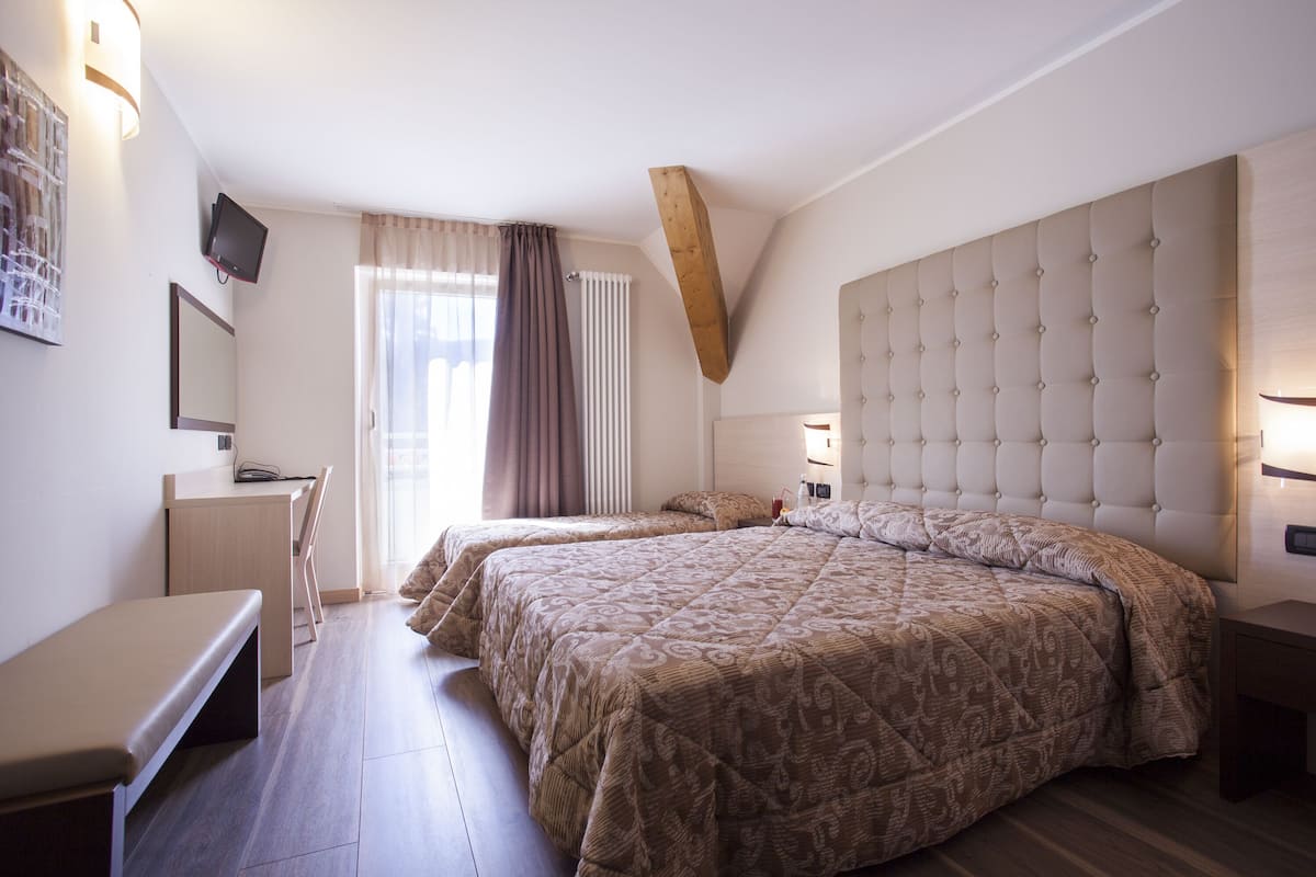 Comfort Triple Room | Frette Italian sheets, Select Comfort beds, in-room safe, desk