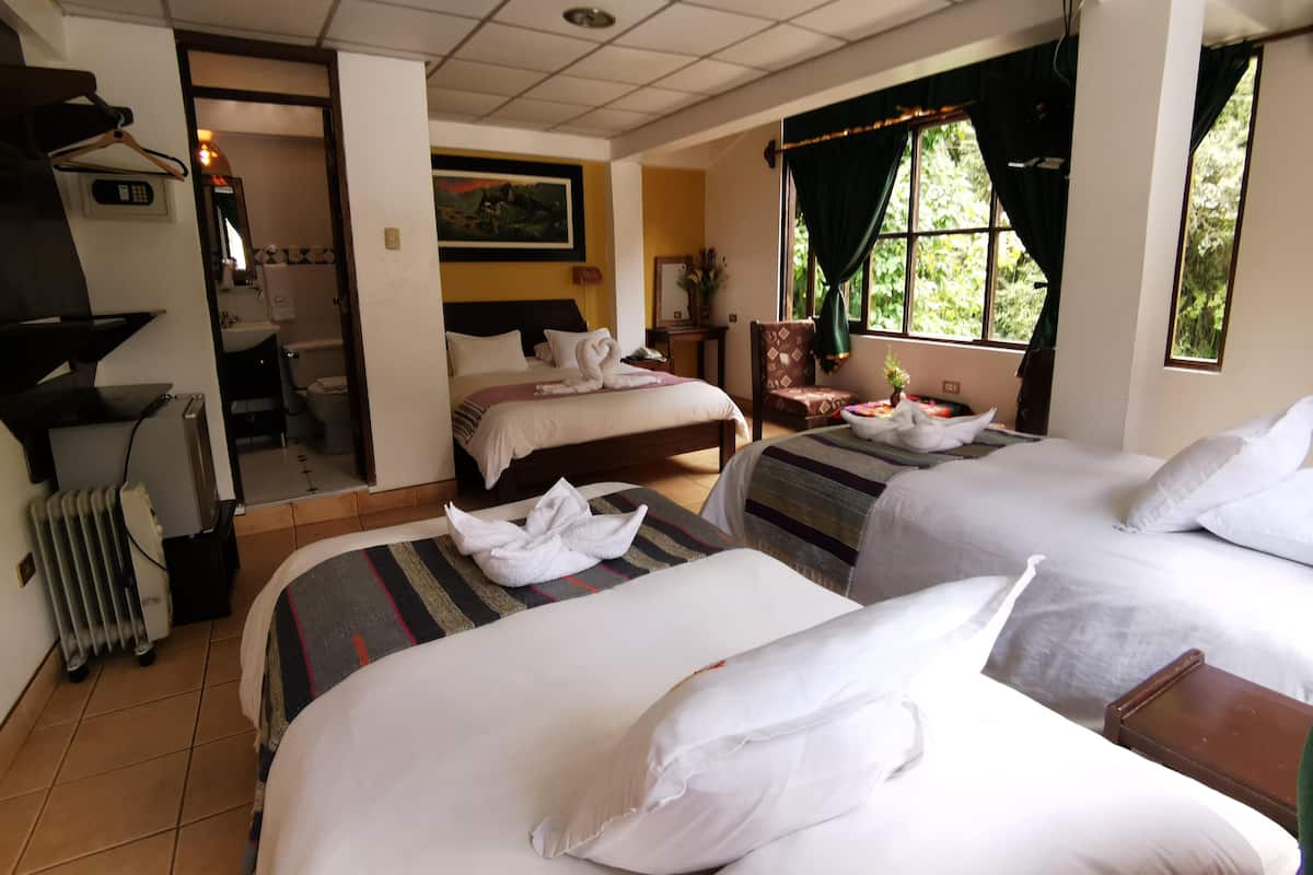 Hypo-allergenic bedding, down duvets, pillow-top beds, in-room safe