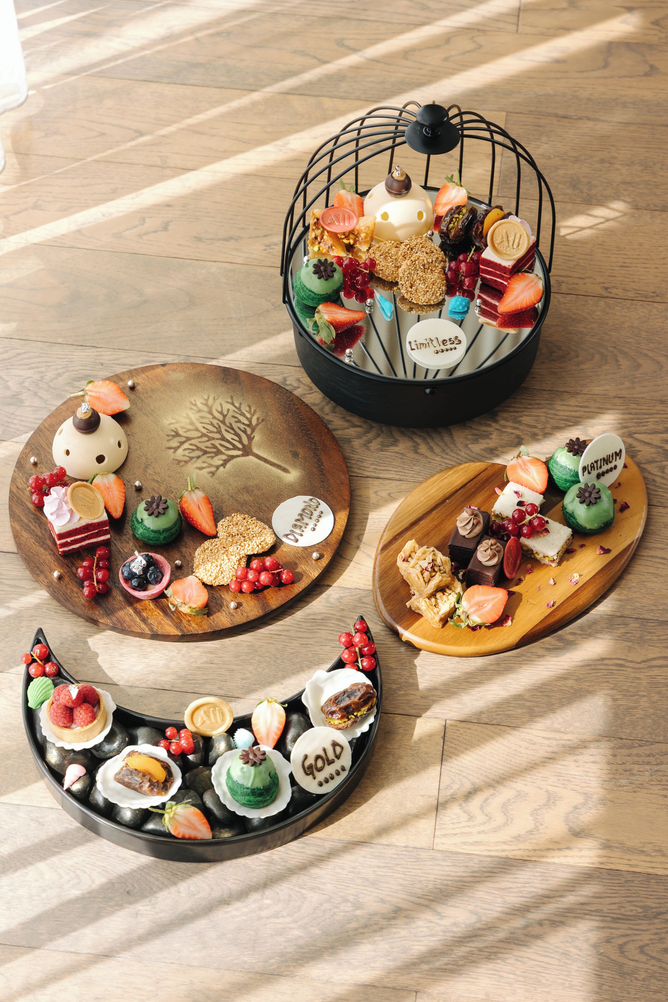A variety of desserts on wooden trays.