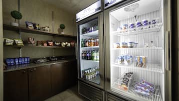 A refrigerated display case with various food items and beverages.