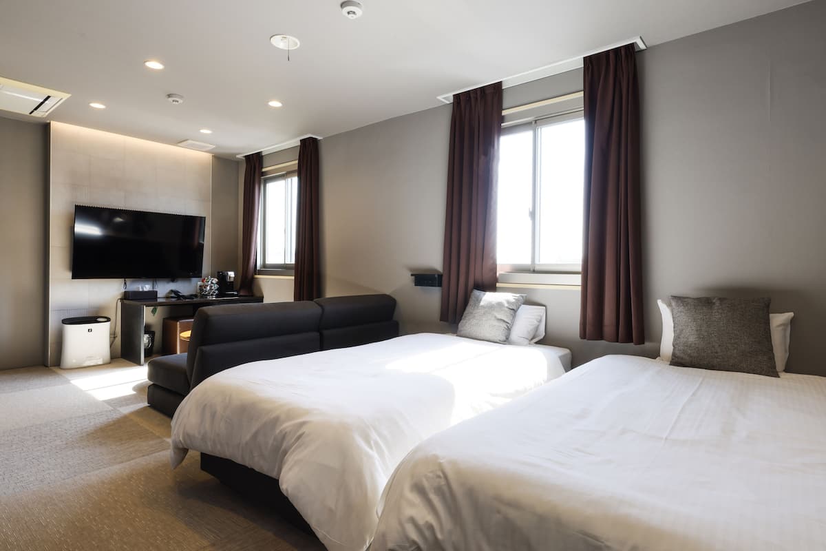 family triple room, 3 single beds, non smoking | 1 bedroom, premium bedding, down duvets, in-room safe