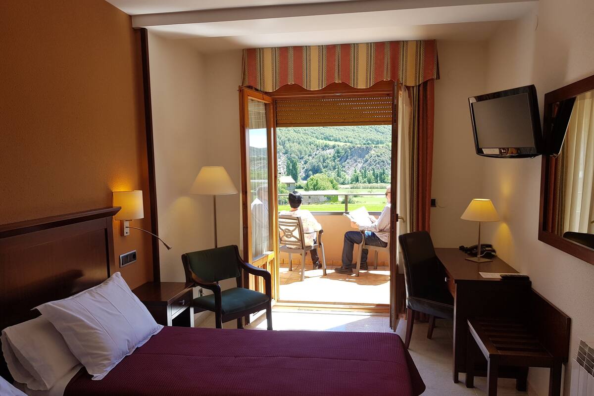 twin room, mountain view (2 single beds) | individually furnished, desk, iron/ironing board, cots/infant beds