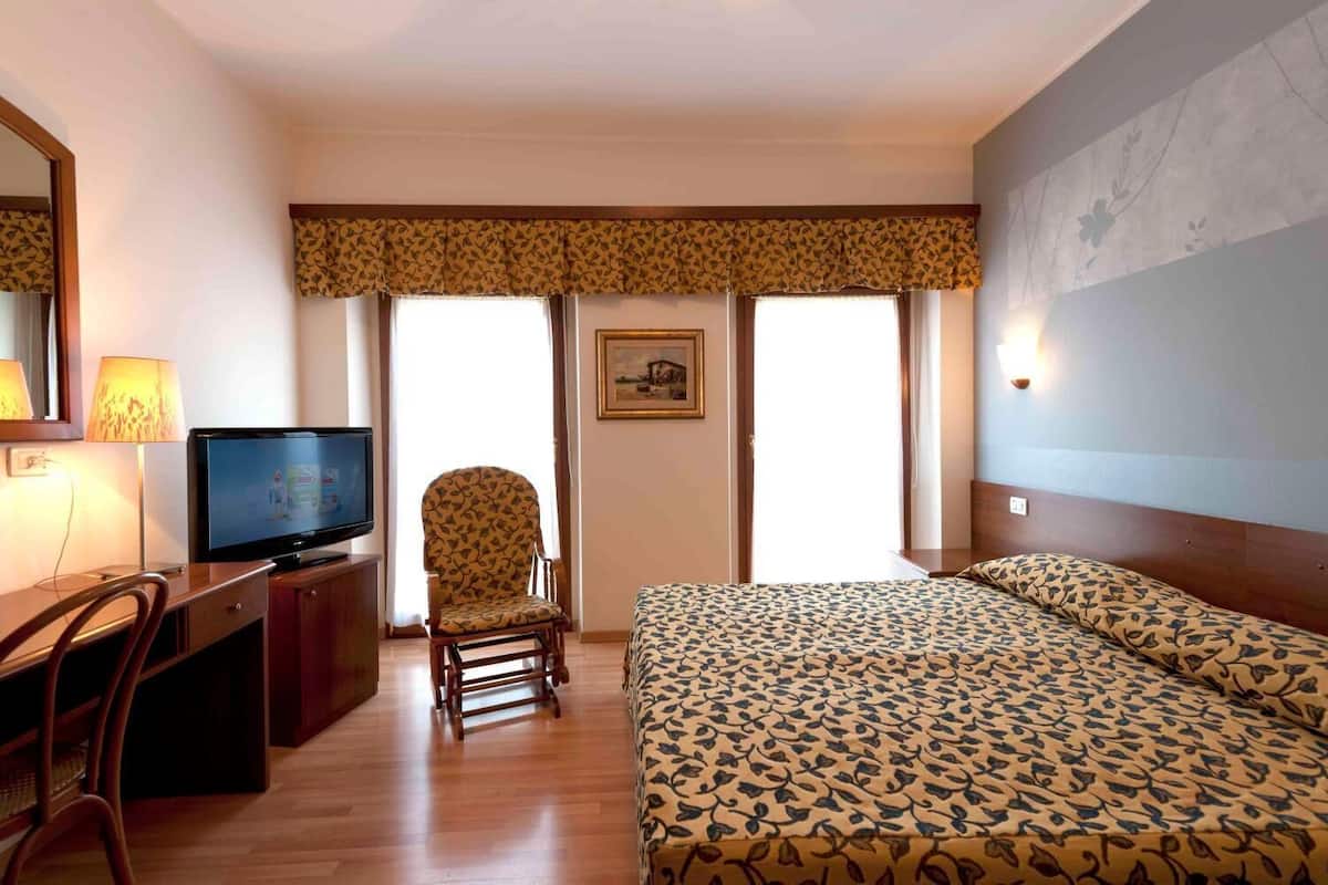 double or twin room | minibar, in-room safe, individually decorated, desk