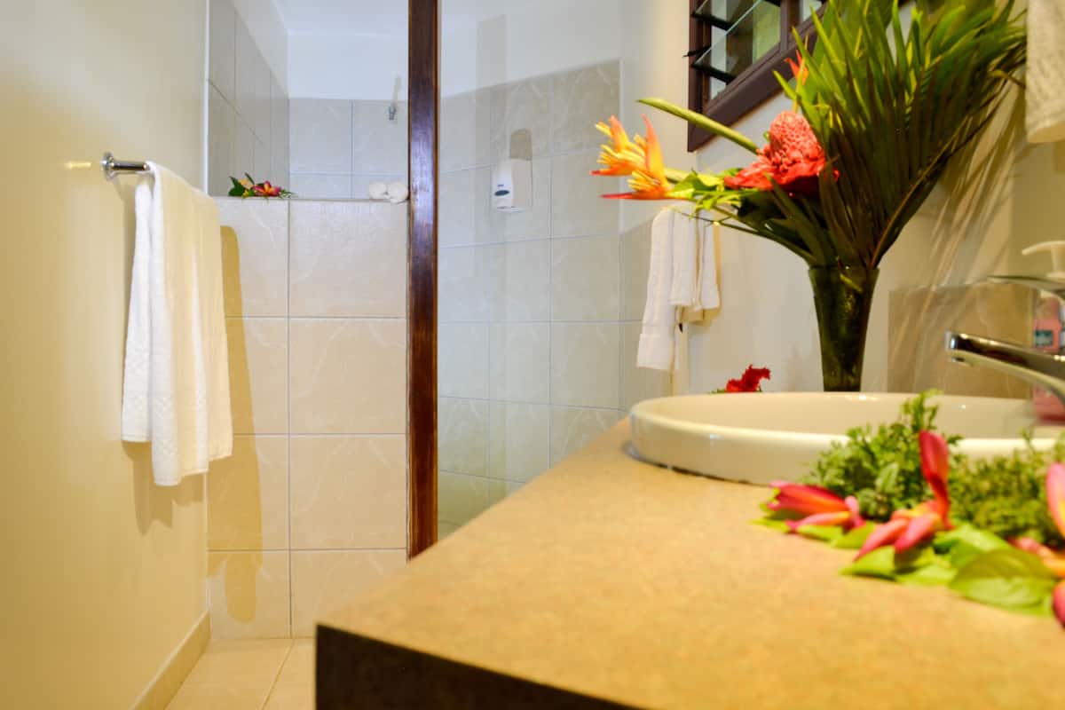 superior bungalow, 1 bedroom, ocean view, oceanfront (fale) | bathroom | shower, hair dryer, bathrobes, towels