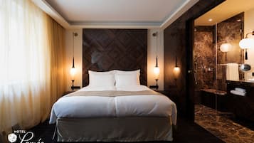 Premium bedding, down duvets, pillow-top beds, in-room safe