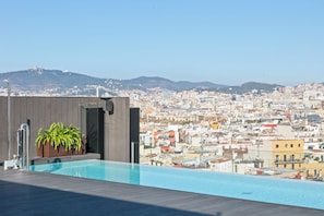 Outdoor pool, open 9:00 AM to 9:00 PM, pool loungers