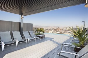 Outdoor pool, open 9:00 AM to 9:00 PM, sun loungers